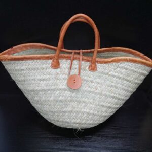 Kikapu/ mkeka has a leather binding handle