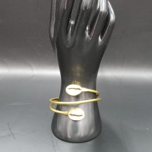 Handmade African double cowrie  shell and brass  cuff with an adjustable back.
